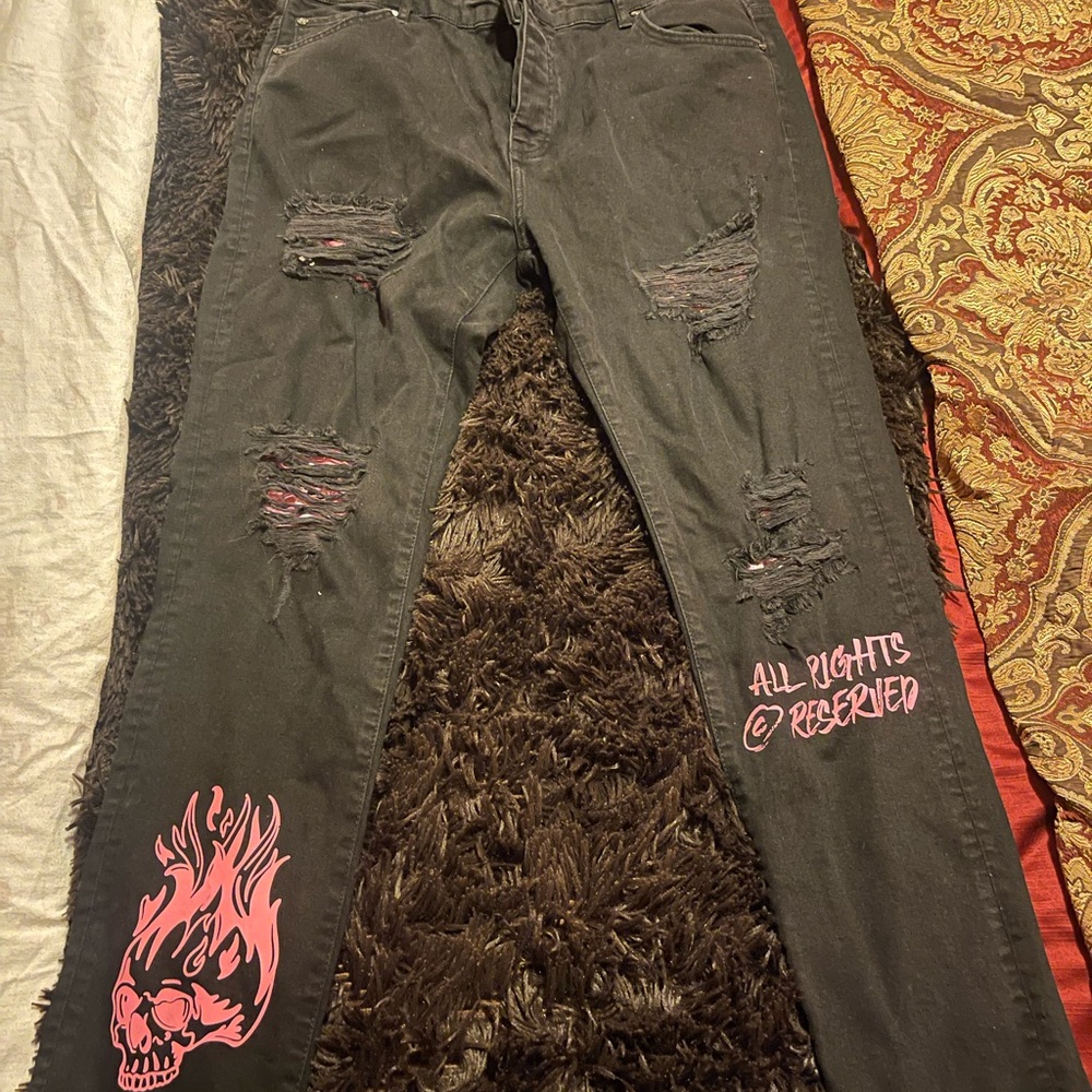 Black Distressed Jeans with Pink Skull Design